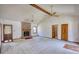 Spacious living room featuring a brick fireplace, ceiling fans, and bright natural light at 380 Hidden Valley Sw Dr, Conyers, GA 30094