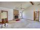 Large living room with a brick fireplace, neutral carpet, vaulted ceiling, and stylish ceiling fan at 380 Hidden Valley Sw Dr, Conyers, GA 30094