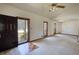 Bright living room with neutral carpet, vaulted ceiling, ceiling fan, and lots of natural light at 380 Hidden Valley Sw Dr, Conyers, GA 30094
