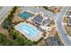 Aerial view showcasing the pool, tennis court, clubhouse and gardens in the neighborhood at 708 Chipping Sparrow St, Canton, GA 30115