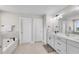 Bathroom with double sink vanity, soaking tub, and modern fixtures at 708 Chipping Sparrow St, Canton, GA 30115
