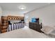 Cozy bedroom featuring a wooden bunk bed with striped bedding and a gray chair at 708 Chipping Sparrow St, Canton, GA 30115