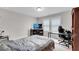 Bedroom features neutral walls, plush carpet, a work desk, and a media center at 708 Chipping Sparrow St, Canton, GA 30115