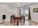 Dining room area adjacent to backyard access featuring table set for four and natural light at 708 Chipping Sparrow St, Canton, GA 30115
