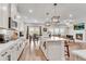 Open kitchen layout with a view of the dining area and living room with a fireplace at 708 Chipping Sparrow St, Canton, GA 30115