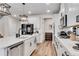 Spacious kitchen featuring a kitchen island with sink and modern stainless steel appliances at 708 Chipping Sparrow St, Canton, GA 30115