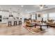 Bright and airy open-concept living area seamlessly connects the kitchen and living spaces at 708 Chipping Sparrow St, Canton, GA 30115