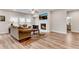 Comfortable living room with a fireplace, ceiling fan, large windows, and plush seating at 708 Chipping Sparrow St, Canton, GA 30115