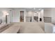 A spacious loft area with neutral carpet and a railing, perfect for relaxing or entertaining at 708 Chipping Sparrow St, Canton, GA 30115