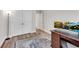 A stylish home office featuring a classic desk, a modern lamp, and an elegant area rug at 708 Chipping Sparrow St, Canton, GA 30115