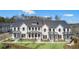 Beautifully designed modern farmhouse style townhomes with manicured lawns and tasteful landscaping at 104 Briargate Dr, Johns Creek, GA 30097