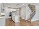 Modern kitchen featuring an island, stainless appliances, and elegant pendant lighting, ideal for culinary enthusiasts at 104 Briargate Dr, Johns Creek, GA 30097