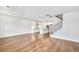 Open-concept living space with gleaming hardwood floors, flowing seamlessly into a modern, well-equipped kitchen at 104 Briargate Dr, Johns Creek, GA 30097
