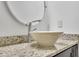Close-up of bathroom featuring vessel sink, modern faucet, and stone countertop at 1363 Sheffield Glen Way, Atlanta, GA 30329