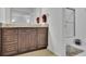 Well-lit bathroom showcases granite counters, warm cabinets, and a tiled shower with glass doors at 1363 Sheffield Glen Way, Atlanta, GA 30329