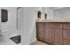 Bathroom with a white toilet and a vanity with a neutral countertop, plus a glass door to the shower at 1363 Sheffield Glen Way, Atlanta, GA 30329