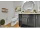 Well-lit bathroom featuring a unique vessel sink, modern vanity, and stylish decor at 1363 Sheffield Glen Way, Atlanta, GA 30329