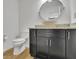 Well-lit bathroom featuring a unique vessel sink and modern vanity at 1363 Sheffield Glen Way, Atlanta, GA 30329