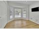 Bedroom featuring natural light, sleek wood floors, and custom shutters offers style and comfort at 1363 Sheffield Glen Way, Atlanta, GA 30329