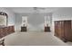 Spacious bedroom with neutral carpeting and large windows offering plenty of natural light at 1363 Sheffield Glen Way, Atlanta, GA 30329