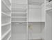 Spacious walk-in closet with custom shelving and hanging rods for ample storage at 1363 Sheffield Glen Way, Atlanta, GA 30329