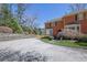 Brick townhome with mature trees and landscaping plus a private drive offers a serene setting at 1363 Sheffield Glen Way, Atlanta, GA 30329