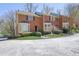 Brick townhome with a well-manicured lawn and a charming bay window adds curb appeal at 1363 Sheffield Glen Way, Atlanta, GA 30329