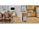 Bright eat-in kitchen featuring stainless steel appliances, stone countertops and light wood cabinets at 1363 Sheffield Glen Way, Atlanta, GA 30329