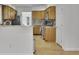 Bright kitchen featuring stainless steel appliances, stone countertops and light wood cabinets at 1363 Sheffield Glen Way, Atlanta, GA 30329