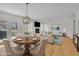 Open-concept floor plan seamlessly connects the dining area to the cozy living space at 1363 Sheffield Glen Way, Atlanta, GA 30329