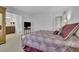 Spacious main bedroom features plush carpet, a TV, and ensuite bath with modern fixtures at 1363 Sheffield Glen Way, Atlanta, GA 30329