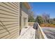 Outdoor patio with weathered wooden floorboards, siding, and a black grill for outdoor cooking enjoyment at 1363 Sheffield Glen Way, Atlanta, GA 30329