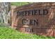 Brick sign showing the community name Sheffield Glen and the address 2271 in black lettering at 1363 Sheffield Glen Way, Atlanta, GA 30329