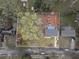 An aerial view showcasing the home's positioning within the lot and the beautiful, wooded surroundings at 1752 Atherton Dr, Decatur, GA 30035