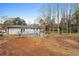 View of a spacious backyard featuring a modern deck, providing ample space for outdoor activities and entertainment at 1752 Atherton Dr, Decatur, GA 30035
