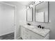 Bathroom featuring double sink vanity with marble countertop and modern fixtures at 1752 Atherton Dr, Decatur, GA 30035