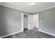 Bedroom featuring grey walls, grey wood floors and closet at 1752 Atherton Dr, Decatur, GA 30035