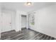 Bedroom featuring new floors, white walls, closet and a window with natural light at 1752 Atherton Dr, Decatur, GA 30035