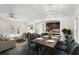 Open-concept design with modern light fixture, dining table and chairs, plus view to the kitchen at 1752 Atherton Dr, Decatur, GA 30035