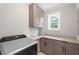 Laundry area featuring new appliances, light grey cabinets and a counter space at 1752 Atherton Dr, Decatur, GA 30035