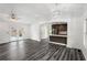 Living space with recessed lighting, view to the modern kitchen, and access to outdoor patio at 1752 Atherton Dr, Decatur, GA 30035