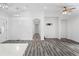 Spacious living room with arched entryways, recessed lighting, luxury vinyl plank flooring and access to other rooms at 1752 Atherton Dr, Decatur, GA 30035