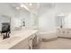 Spacious bathroom with dual sinks, a large soaking tub and a separate vanity at 2731 Old Coach Rd, Duluth, GA 30096