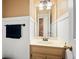 Traditional bathroom with wainscoting, neutral vanity, and decorative lighting at 2731 Old Coach Rd, Duluth, GA 30096