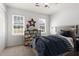 Bright bedroom features a playful race car theme, neutral walls and carpeting, and bright natural light at 2731 Old Coach Rd, Duluth, GA 30096