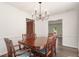 Spacious dining room with decorative chairs and a modern chandelier at 2731 Old Coach Rd, Duluth, GA 30096