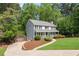 Lovely home with a long driveway, well-maintained lawn and attractive landscaping at 2731 Old Coach Rd, Duluth, GA 30096