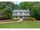 Charming two-story home with a welcoming front porch and well-manicured landscaping at 2731 Old Coach Rd, Duluth, GA 30096