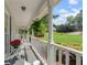 Relaxing front porch with white rocking chairs and picturesque views of the neighborhood at 2731 Old Coach Rd, Duluth, GA 30096