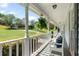 Spacious front porch with comfortable seating and views of the landscaped yard at 2731 Old Coach Rd, Duluth, GA 30096